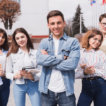 man-surrounded-by-smart-students-with-books-looking-camera_23-2148166282